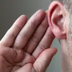 man listening for noise